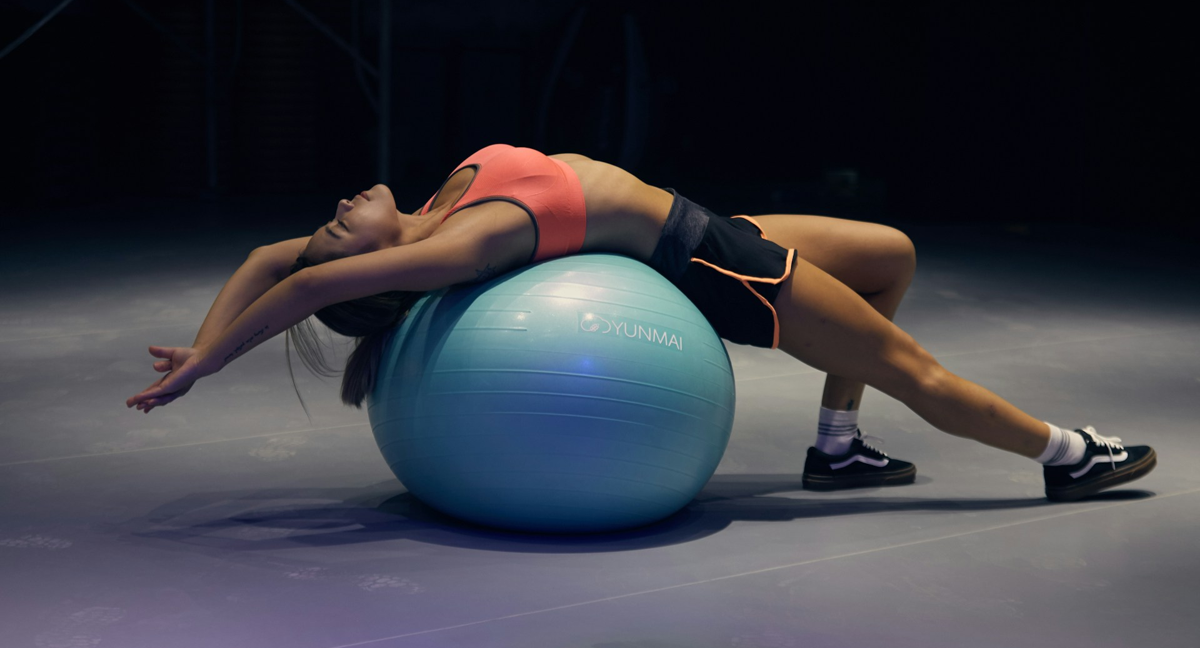 A woman performing a lower back stretch